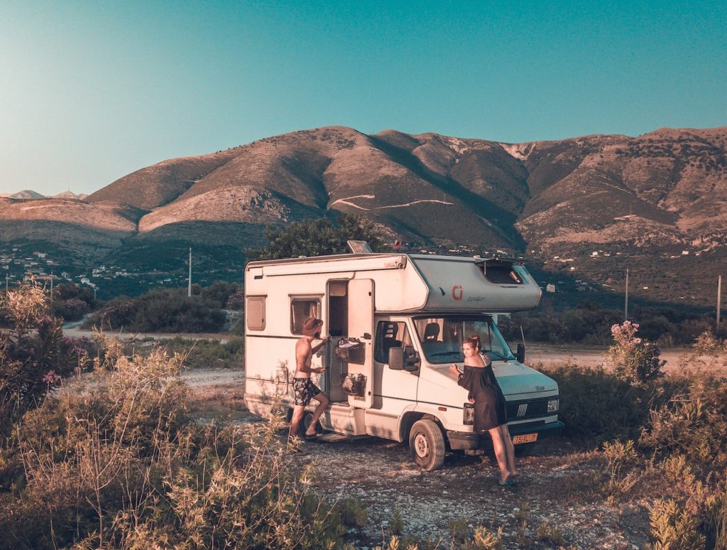 RV in front of mountains and sage