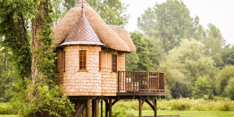 A turreted treehouse with special features to make it a kid's favorite