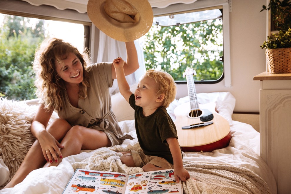 rv traveling with children - mom and toddler on rv bed
